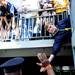 Michigan fan Cole Pugsley, 14, Ontario, Canada, reaches through the rails above the tunnel for a high five after Michigan beat Eastern, 31-1 and Michigan Stadium on Saturday. Melanie Maxwell I AnnArbor.com